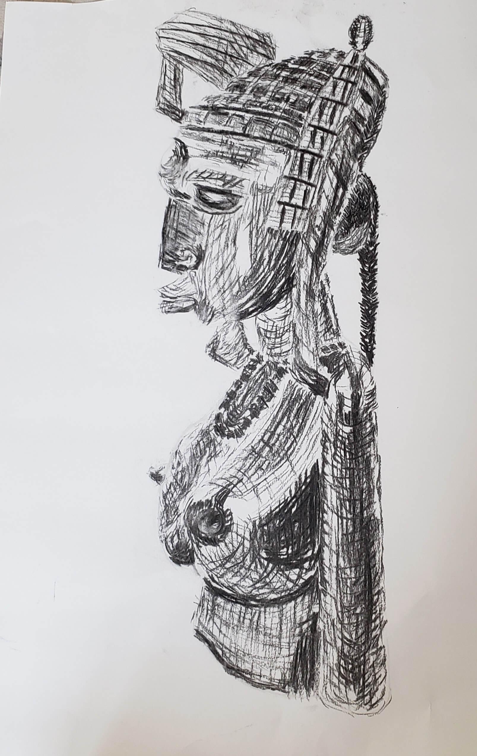 dessin au fusain d'une statuette africaine